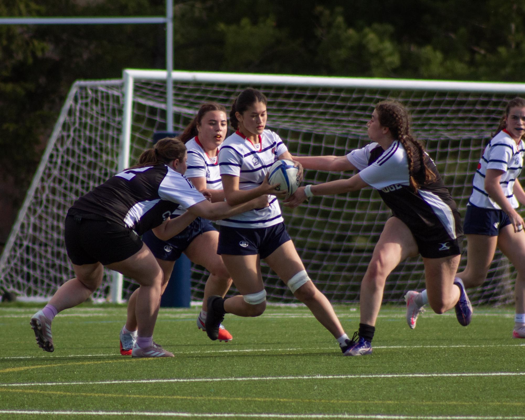 The girls varsity rugby team beat the Cambridge Rindge and Latin Falcons with a dominant 52-5 win. The Warriors have their sights set on the state championship. 
