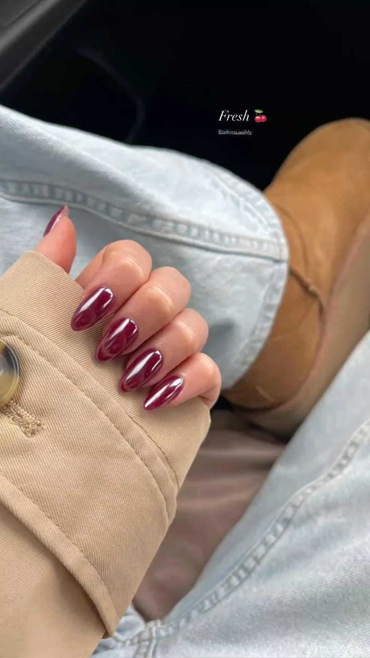 Glossy berry red chrome almond nails for a trendy fall manicure