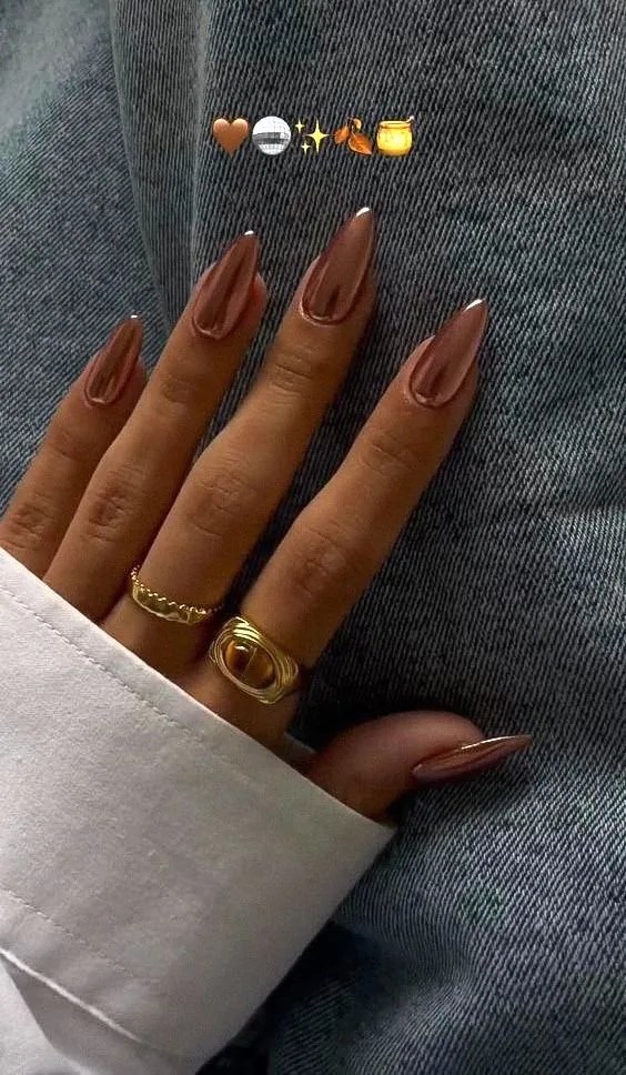 Copper chrome almond nails with a warm reflective metallic finish for fall