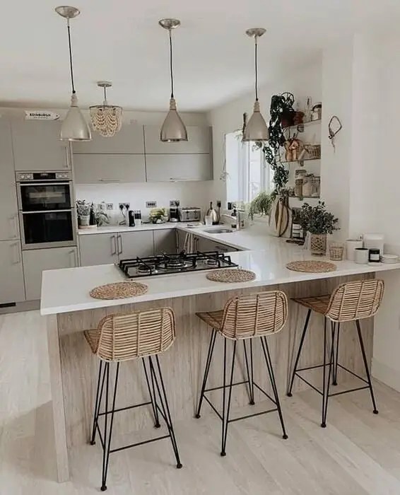 Use bar stools in a grey kitchen to add a chic element as well as some color. You can go minimalist or vibrant depending on your preferred decor style.