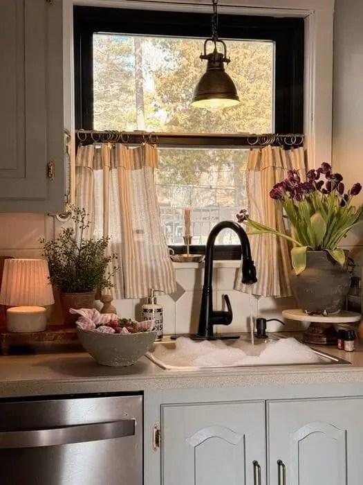 Hang chic cafe curtains in a grey kitchen for a beautiful vintage look and to add color