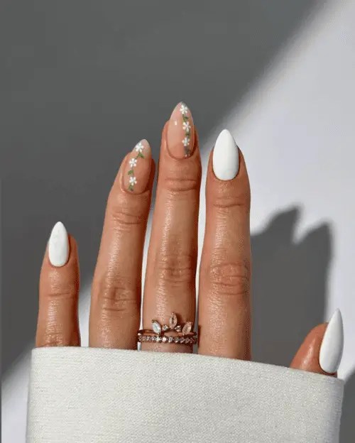 White nails with daisy chains painted on accent nails are cute and feminine summer nails