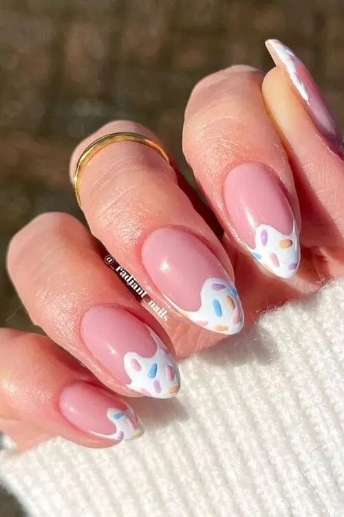 White french tip summer nails with colorful sprinkle designs inspired by ice cream for a fun, playful look.