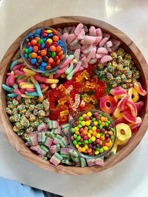 Candy charcuterie board for 19th birthday party movie night in the backyard