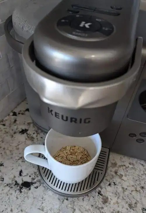 Dorm cooking with a Keurig—photo shows instant oatmeal being made with hot water from a Keurig. Ideal for small space student meal prep.