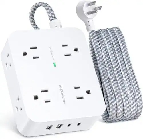 Essential dorm room setup featuring a surge protector powering a laptop, lamp, and phone—perfect solution for students needing more outlets and device protection in 2025.