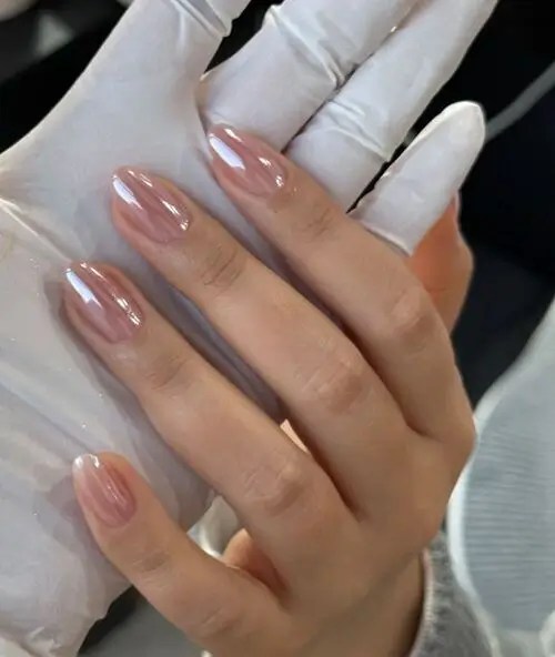 Light blush chrome nails with a soft pink metallic sheen, elegant and understated for a classy summer manicure.