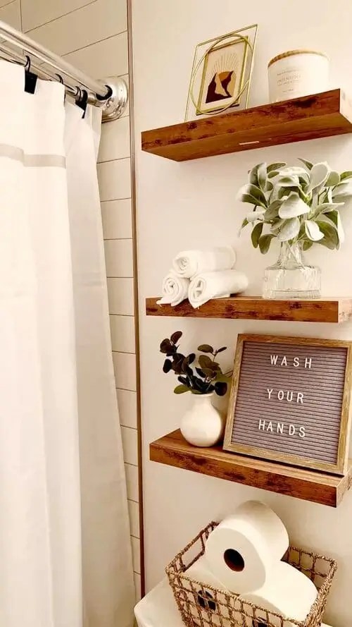 Add a custom sign for above toilet decor where you can leave cute custom messages for guests like "Wash Your Hands"