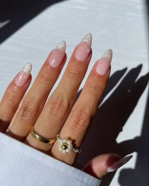 Subtle pearl accents give a sophisticated vibe to summer nails 2025