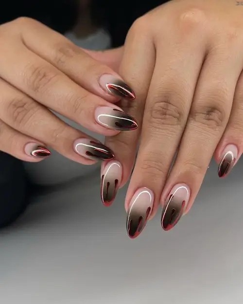 French tip Halloween nails with ombré shading and red blood drip nail art design
