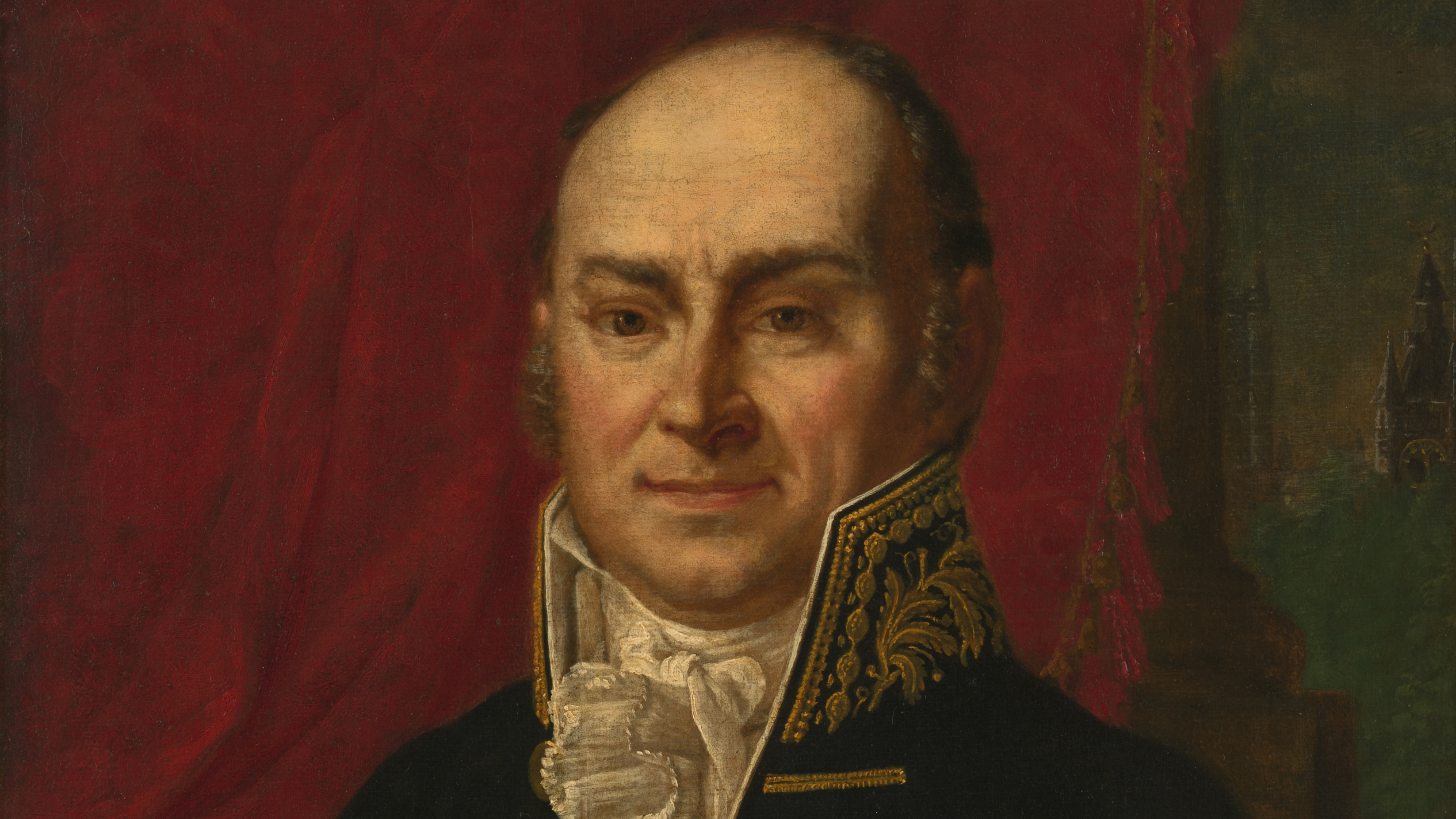 A balding middle-aged man in early 19th-century formal attire with an ornately embroidered dark jacket and white cravat is portrayed against a deep red and green background.