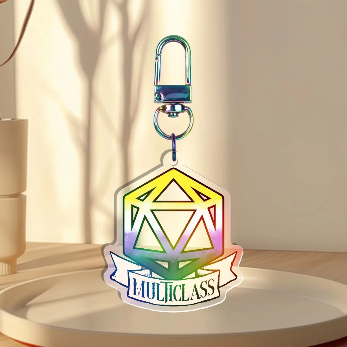 Keychain Design – D20 die filled with non-binary flag with a banner that states “multiclass”, front with a iridescent holographic overlay