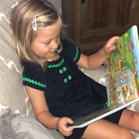 Lily is 5 and enjoys "reading" the stories to her little brother, and they get more elaborate every time.