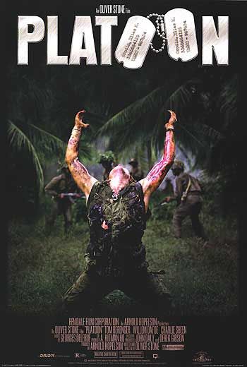 A soldier kneels with arms raised under a dark sky, surrounded by palm trees at night.