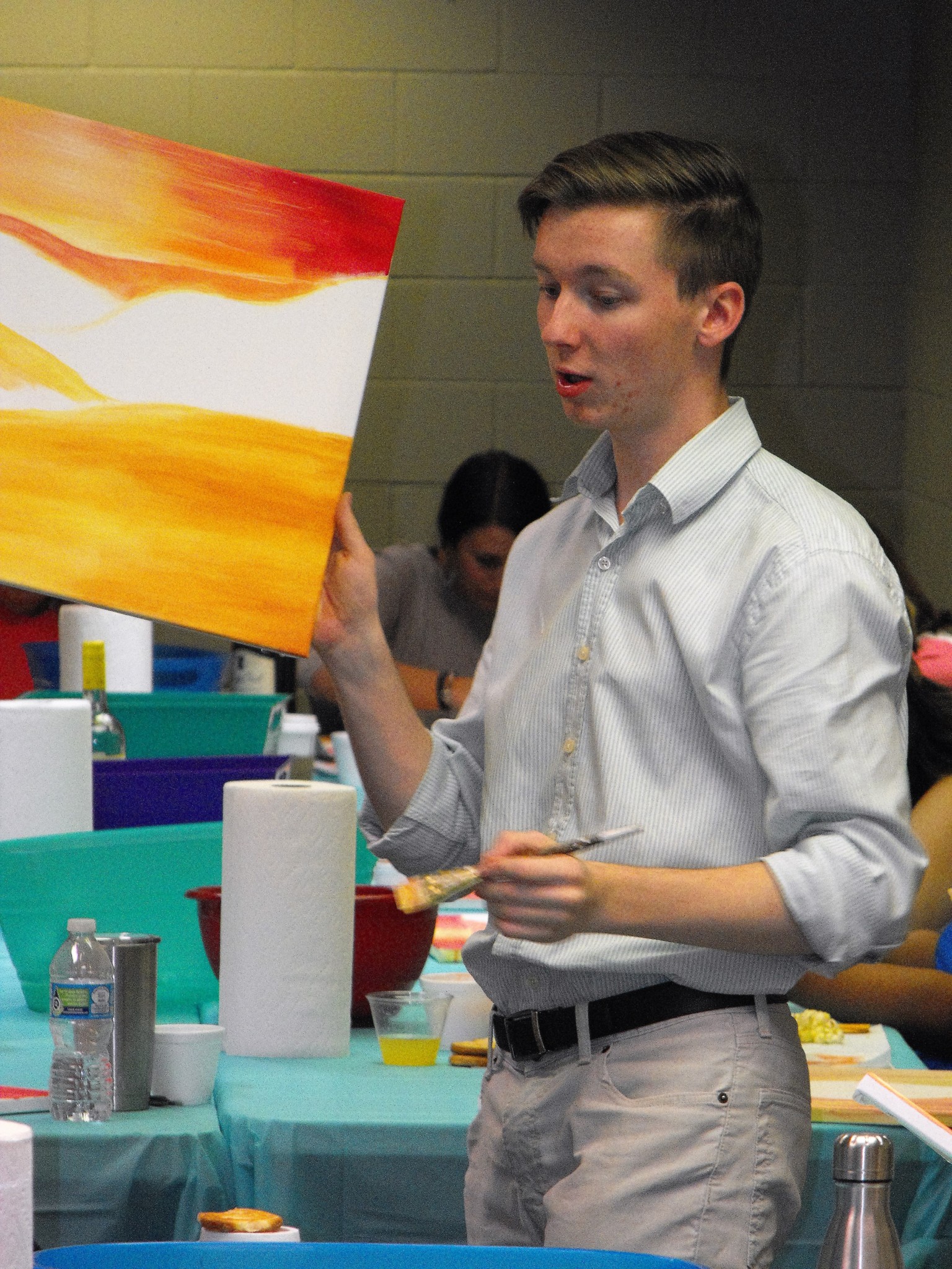 Art instructor and CTFAC employee, Miller Wells, giving the ladies some painting tips.