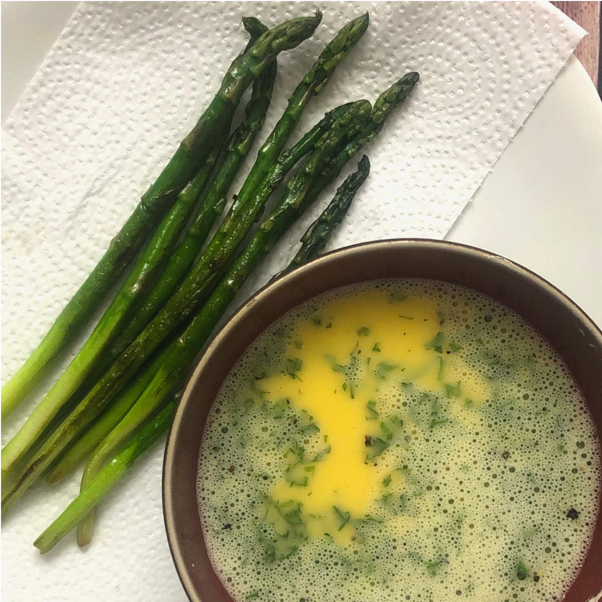 cooked asparagus and eggs with parsley to make asparagus omelette