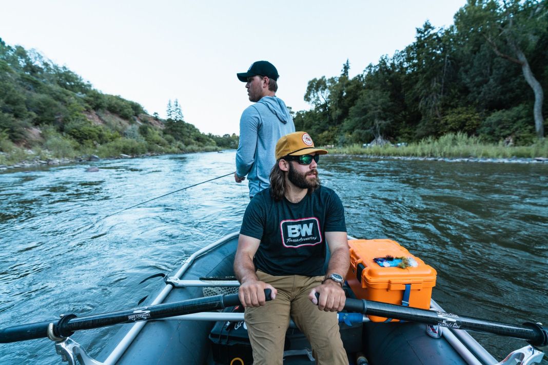 float fishing from the back of the boat 