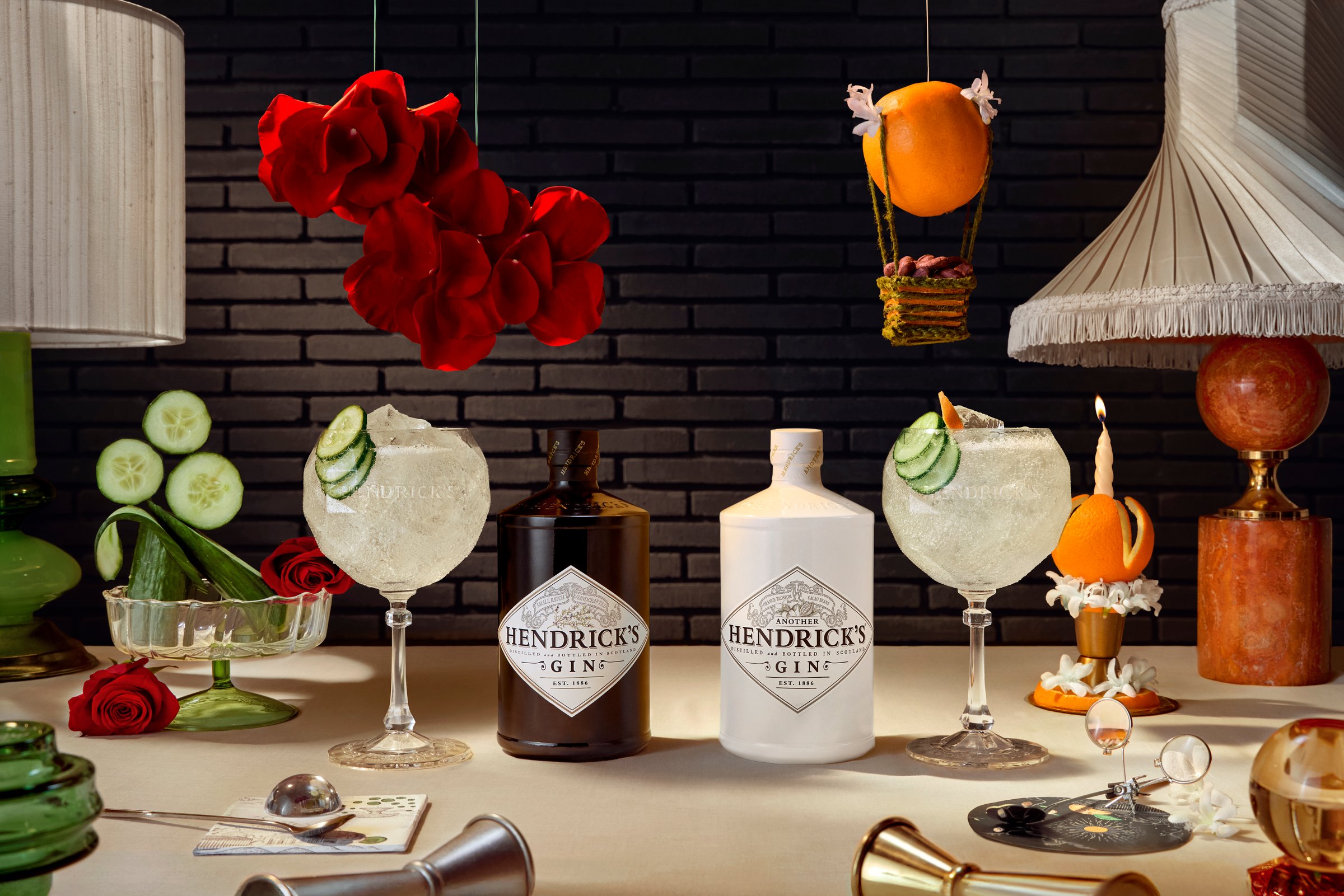 The Forge - Both Hendrick's gin bottles with a copa glass on a set table.