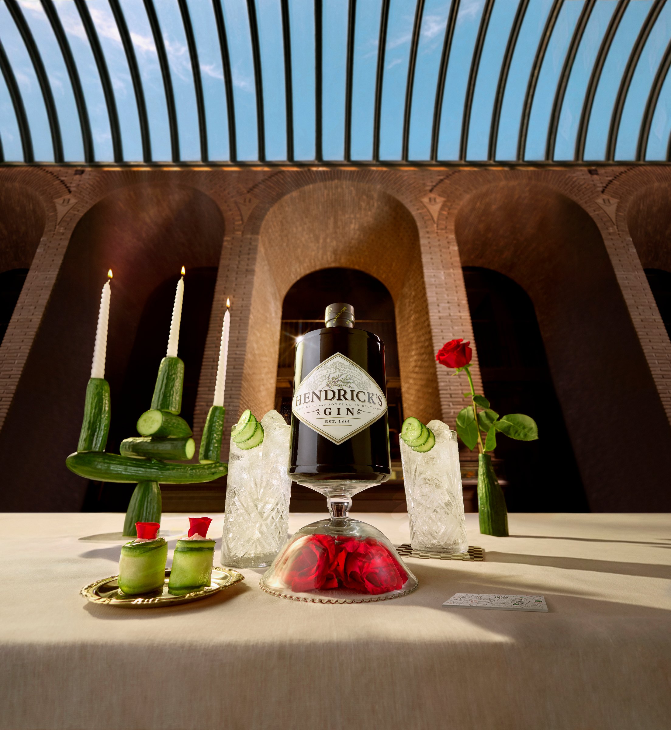 The Forge - Hendrick's Original gin on a candlelit table beneath a glass roof.