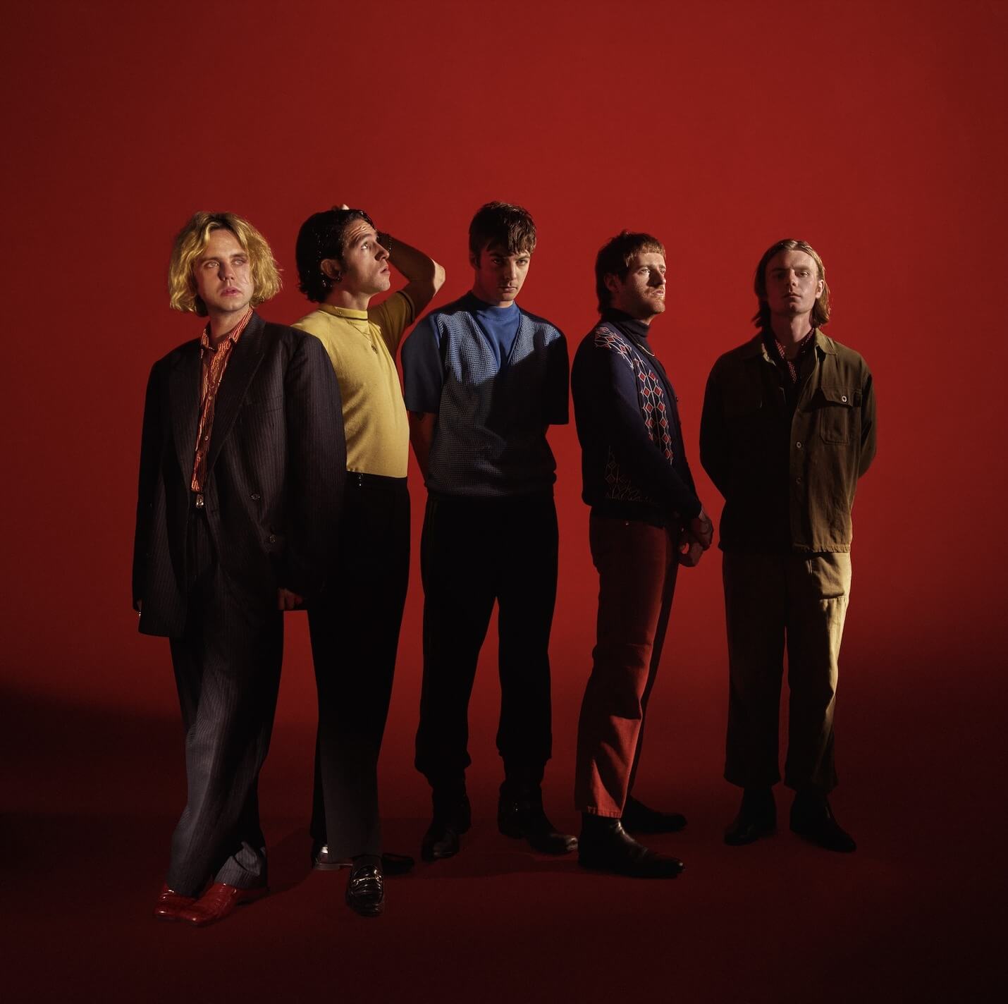 Photo of Dublin band Fontaines D.C. on a red background
