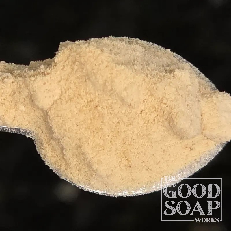 Close-up of Carrot Powder on a spoon, a natural colorant and botanical ingredient used in soap and skincare by The Good Soap Works Co.