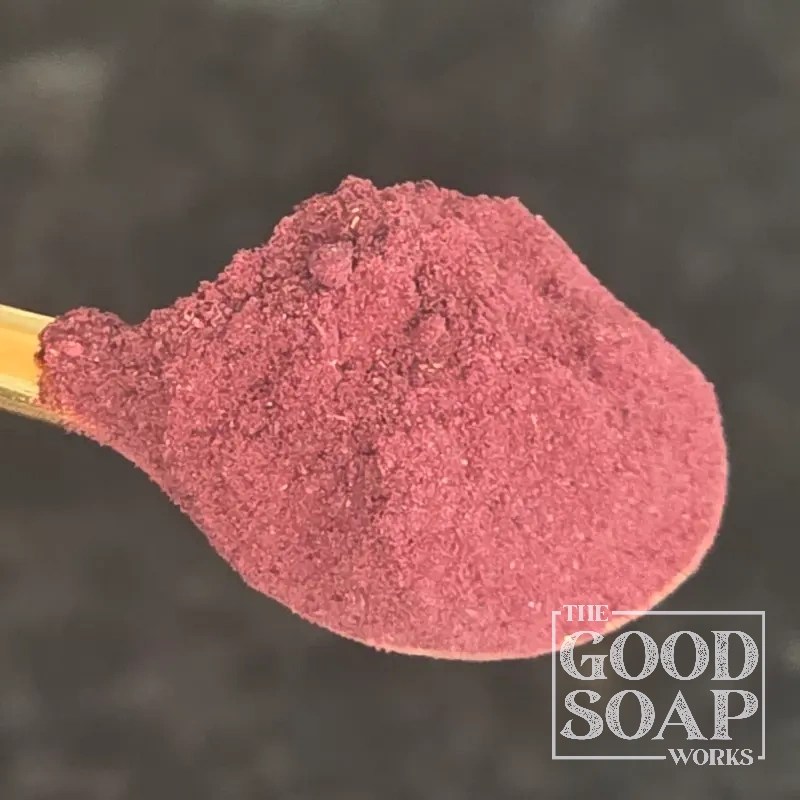 Close-up of Hibiscus powder on a spoon, a natural colorant and botanical ingredient used in soap and skincare by The Good Soap Works Co.