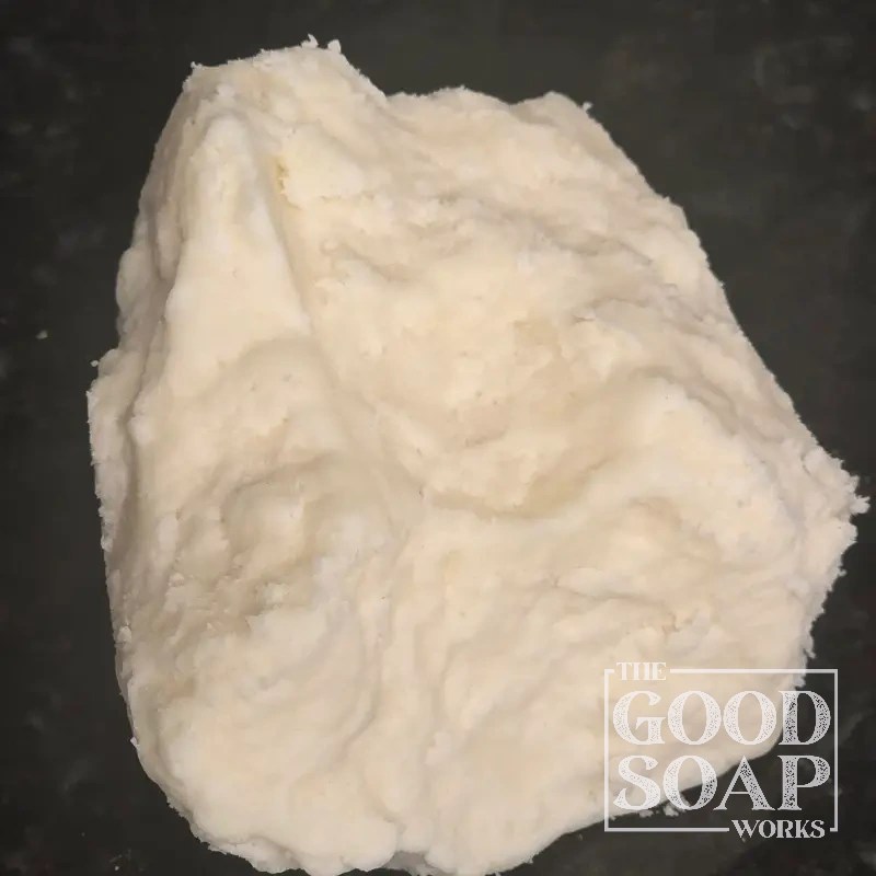 Block of Mango Butter showing its pale yellow solid texture, a natural butter used in soap and skincare by The Good Soap Works Co.