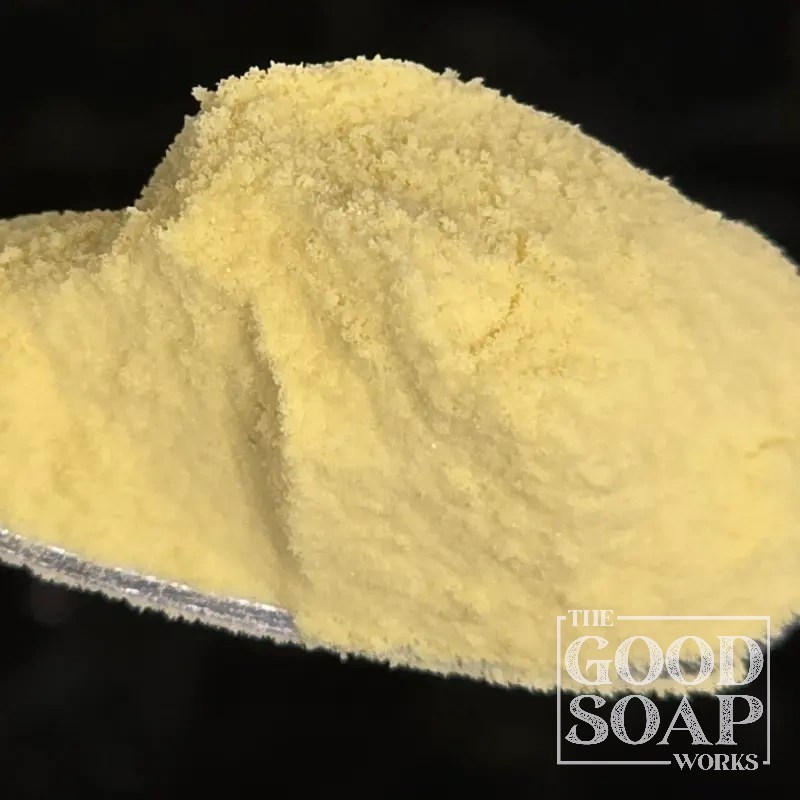 Close-up of Mango Powder on a spoon, a powder ingredient used in soap and skincare by The Good Soap Works Co.