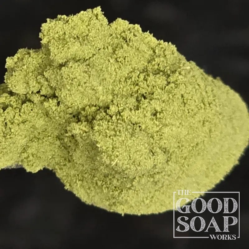 Moringa powder — a deep green botanical superfood powder used as a natural colorant in handmade soap