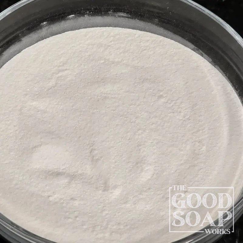 SCI sodium cocoyl isethionate powder in a bowl — a coconut-derived gentle surfactant for shampoo bars