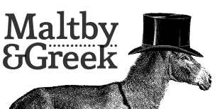 A donkey wearing a tall black top hat.