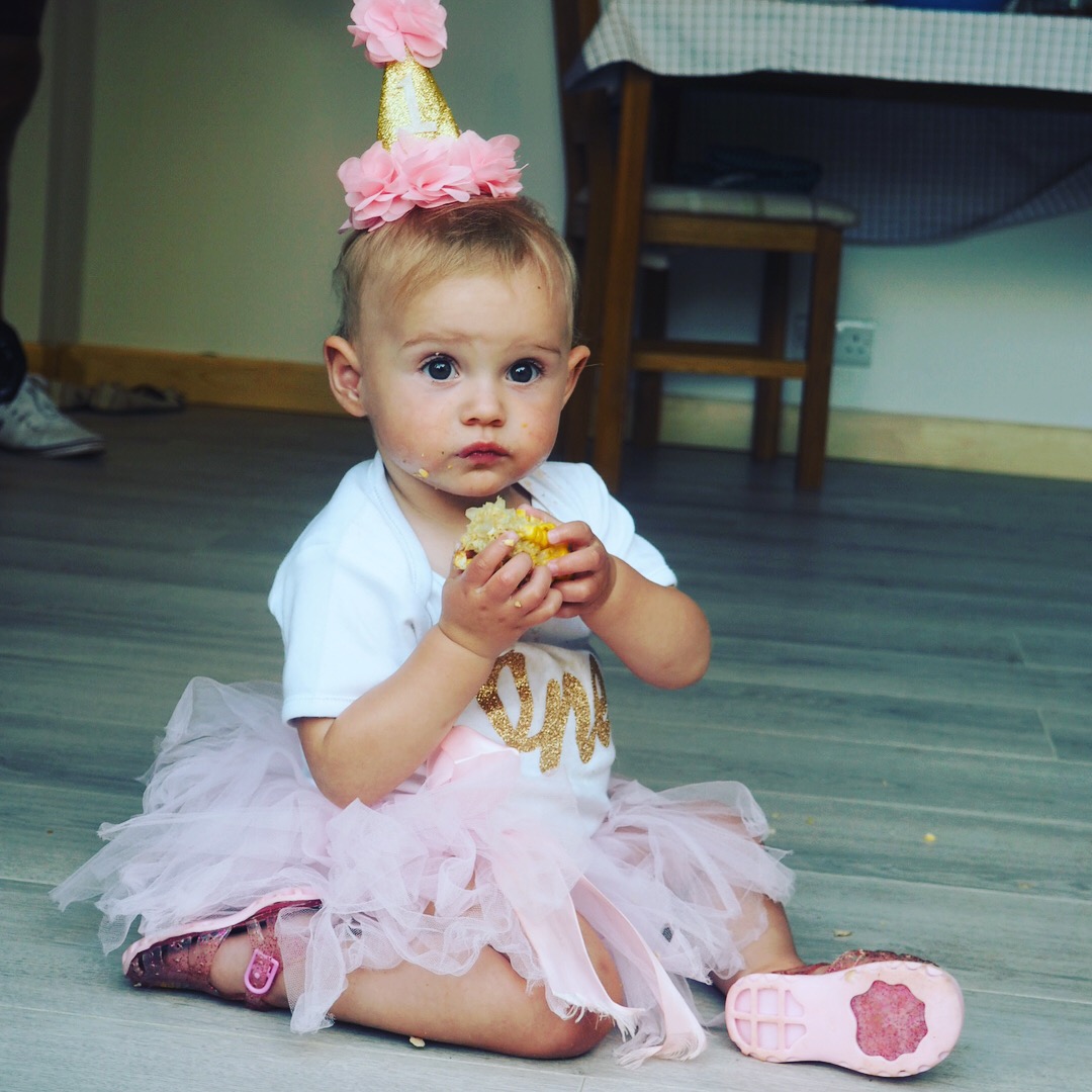 girl in pink tutu and 1 birthay hat