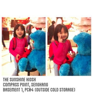 This sweet girl is so excited to see Cookie Monster and Elmo!