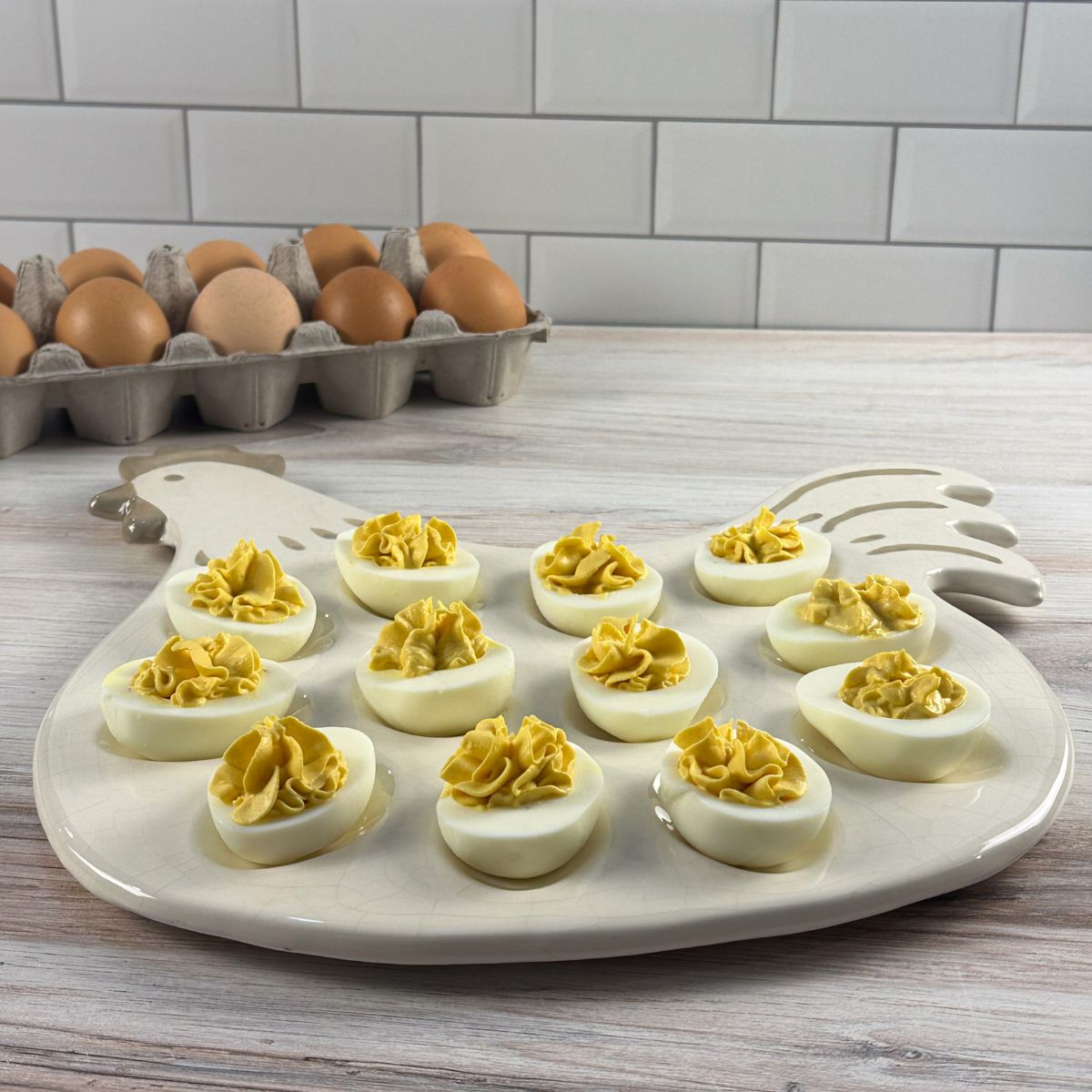 Plate of deviled eggs next to brown eggs.