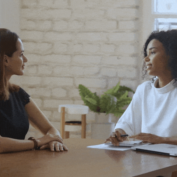 Two women shaking hands in agreement
