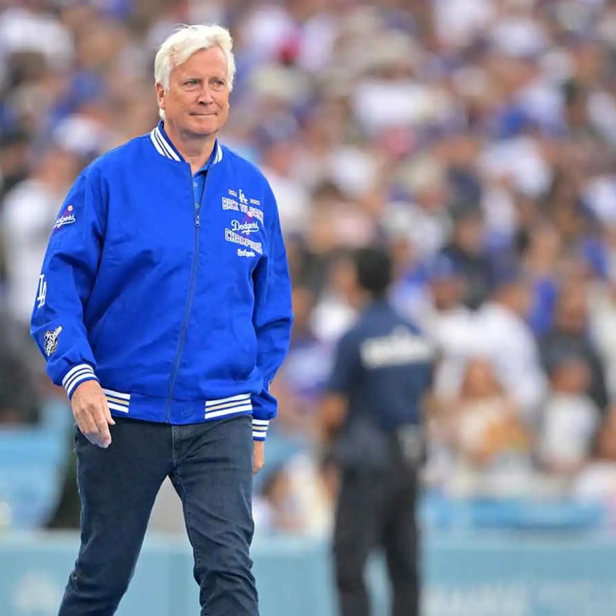 Man in a blue jacket walking