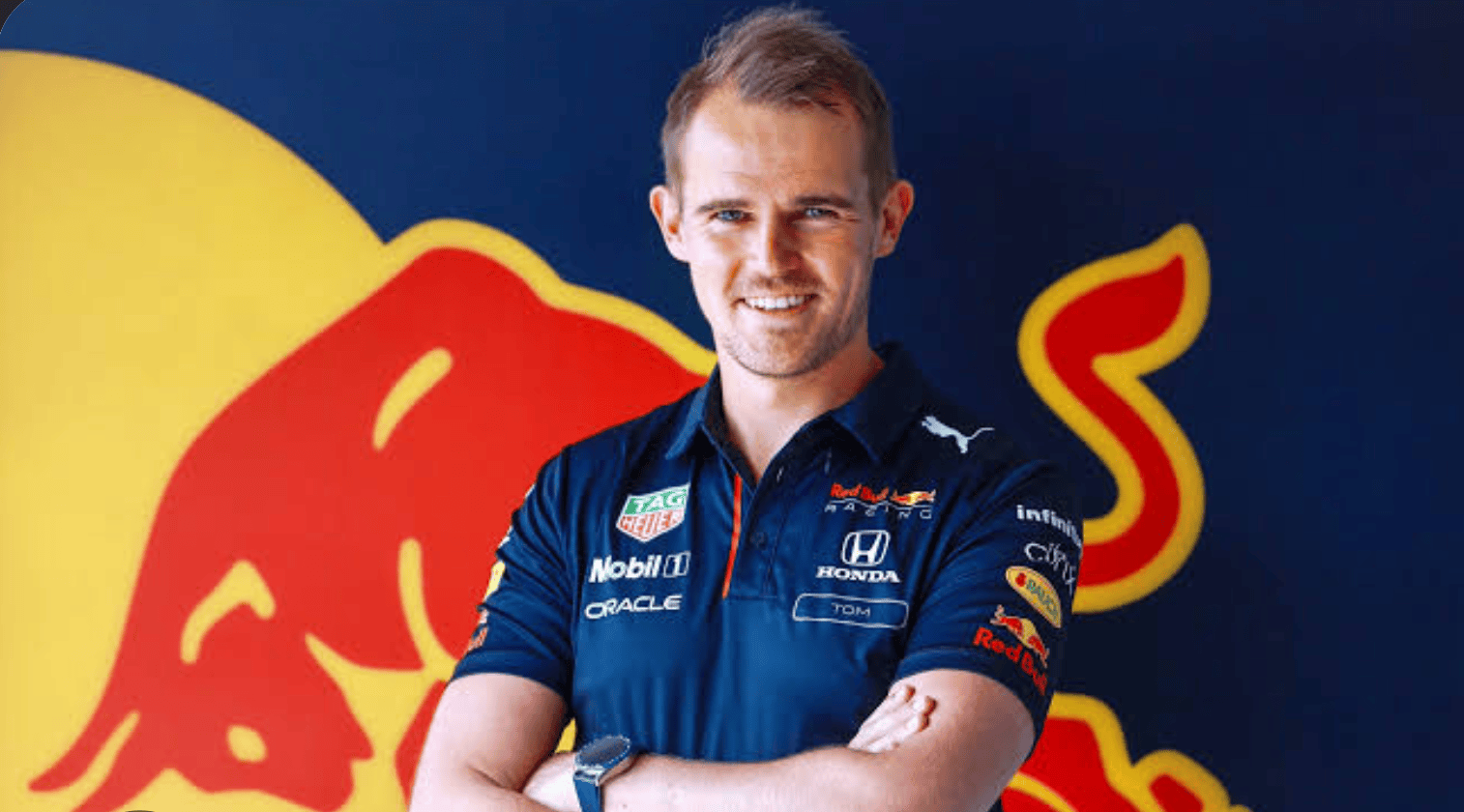 man in a red bull uniform