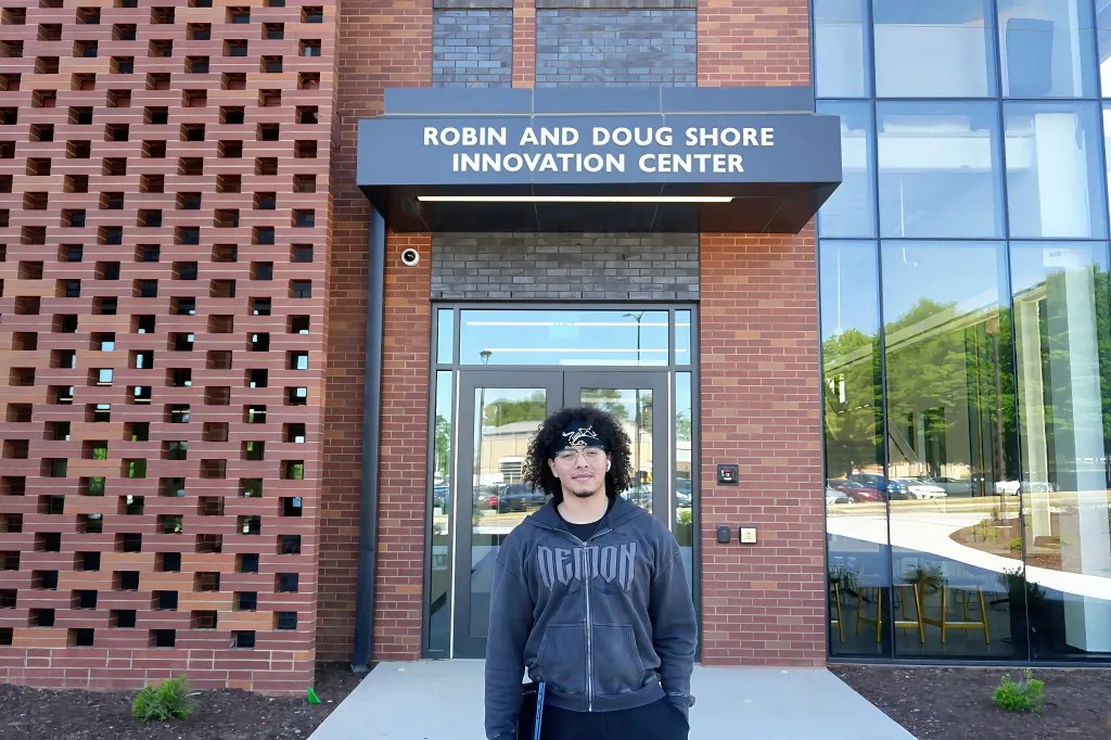 KSU student Zakaria Elghazzali stands in front of the new Robin and Doug Shore Innovation Center on the Marietta campus. Photo by Devyn Byers.
