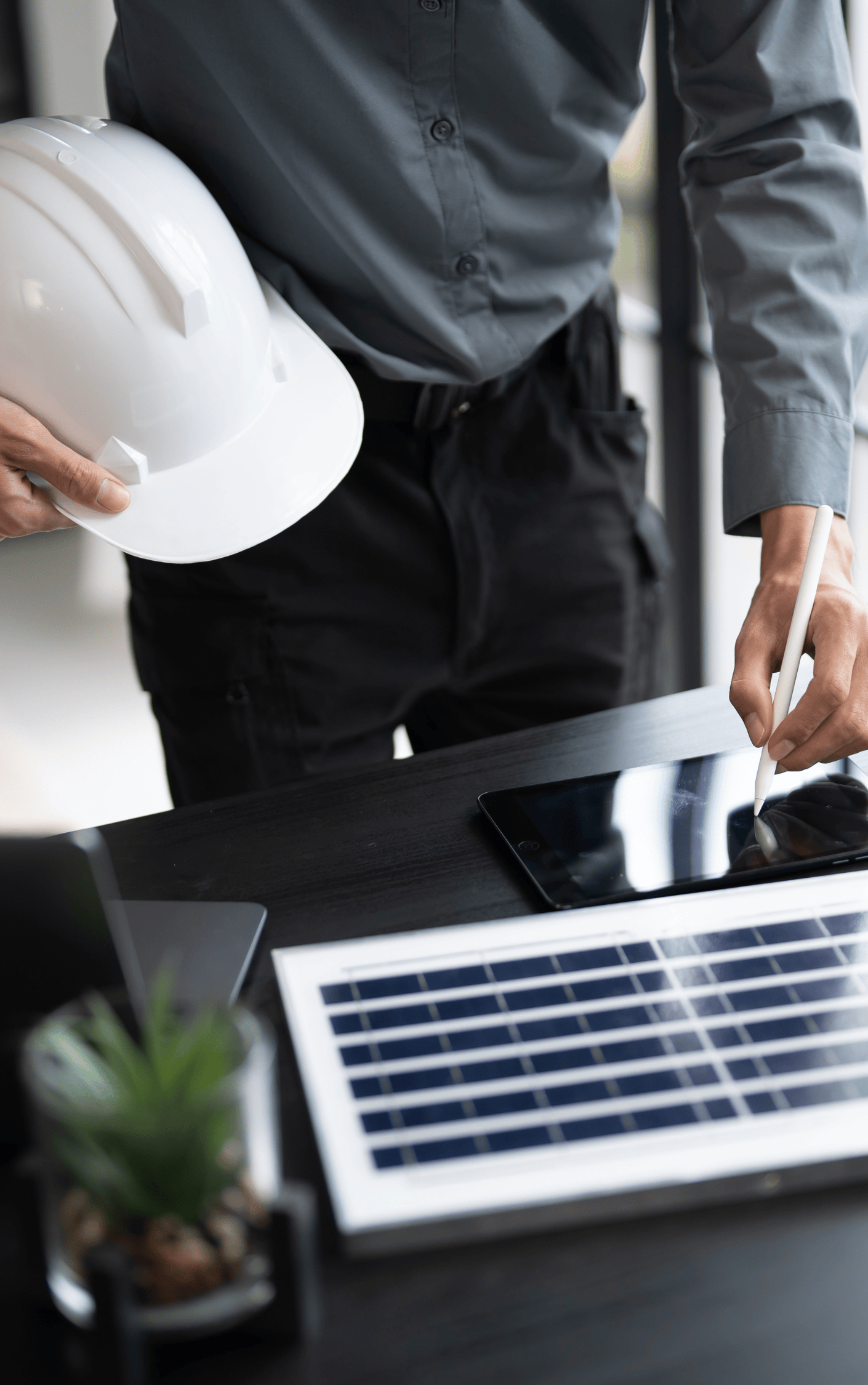 Person holding hard hat with solar panel