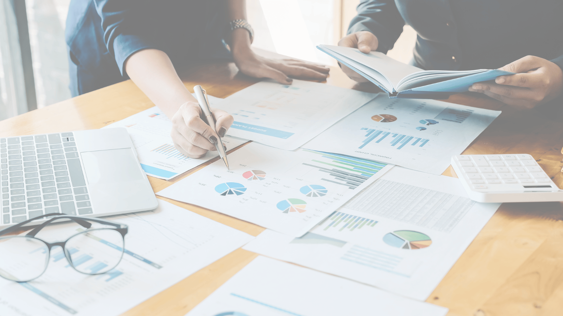 Financial documents and charts on desk