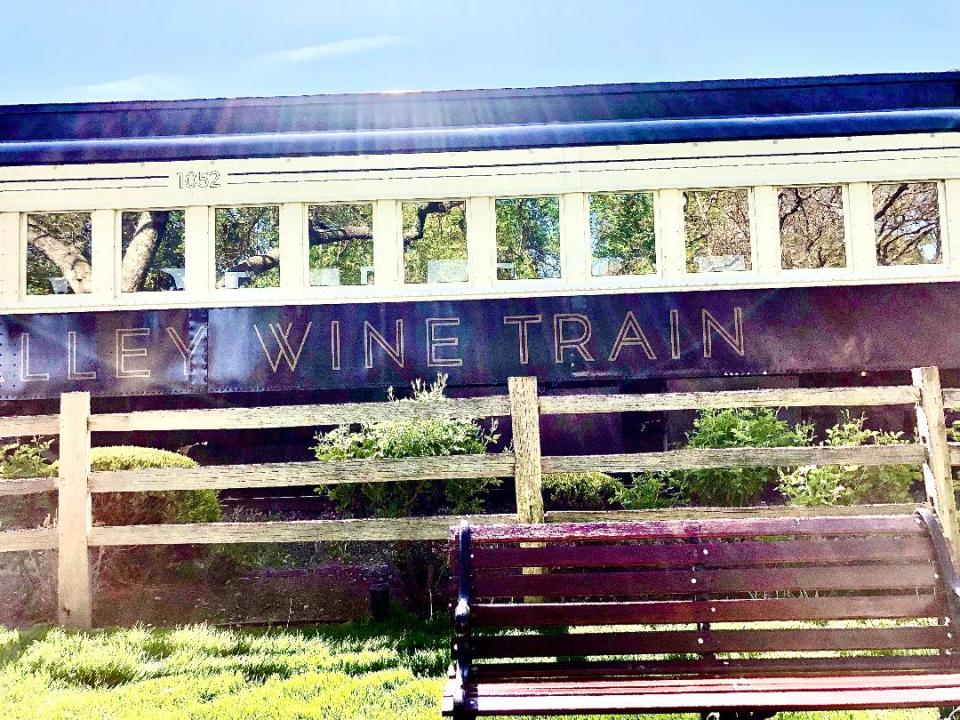 Picutre of a train car with the words wine train written on the side