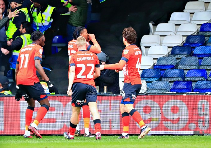 Gabriel Osho makes a crybaby gesture to the Watford fans after scoring in the derby clash