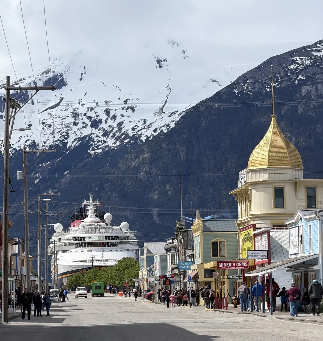 View of the Disney Magic in the back ground, looking down State Street in Skagway, AK
