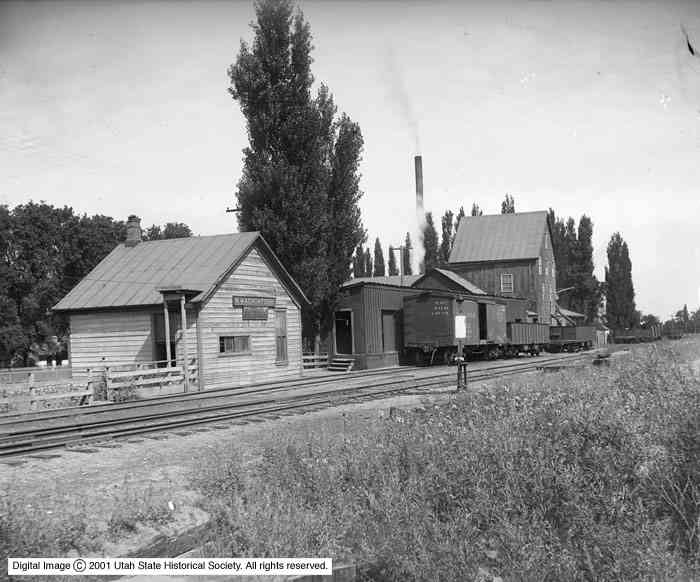 balck and white color Image of an old Houses along the train railings