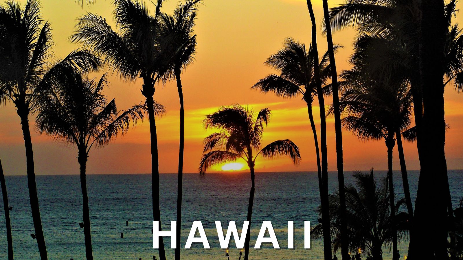 Sunset over the ocean in Hawaii with silhouetted palm trees and the word “Hawaii” in white text.