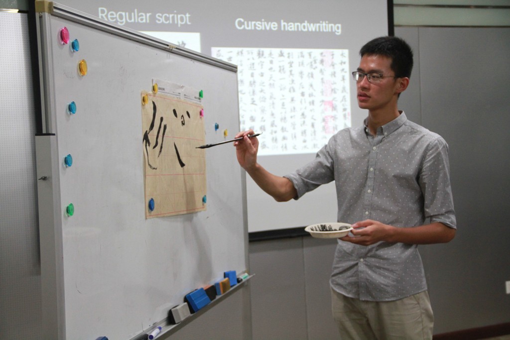 Daniel going over the basic strokes of Chinese calligraphy