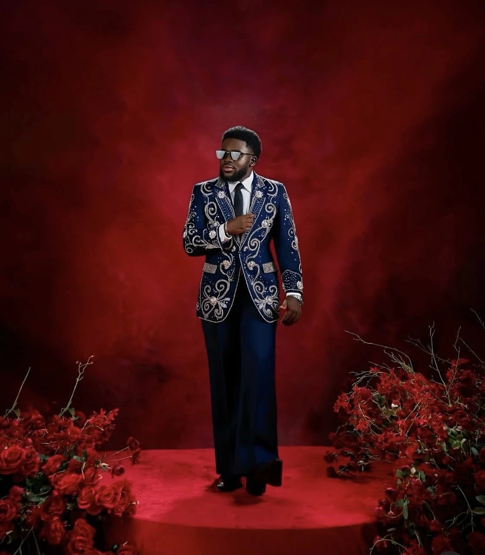 Folagade Banks opened the premiere in a silver suit before changing into a printed tailored look for his second appearance.