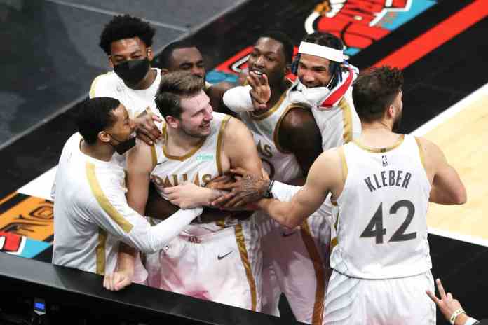 Mavs The Mavericks players celebrating after Luka's game winning shot.