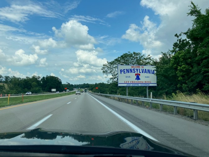 Welcome to Pennsylvania sign along side of road.