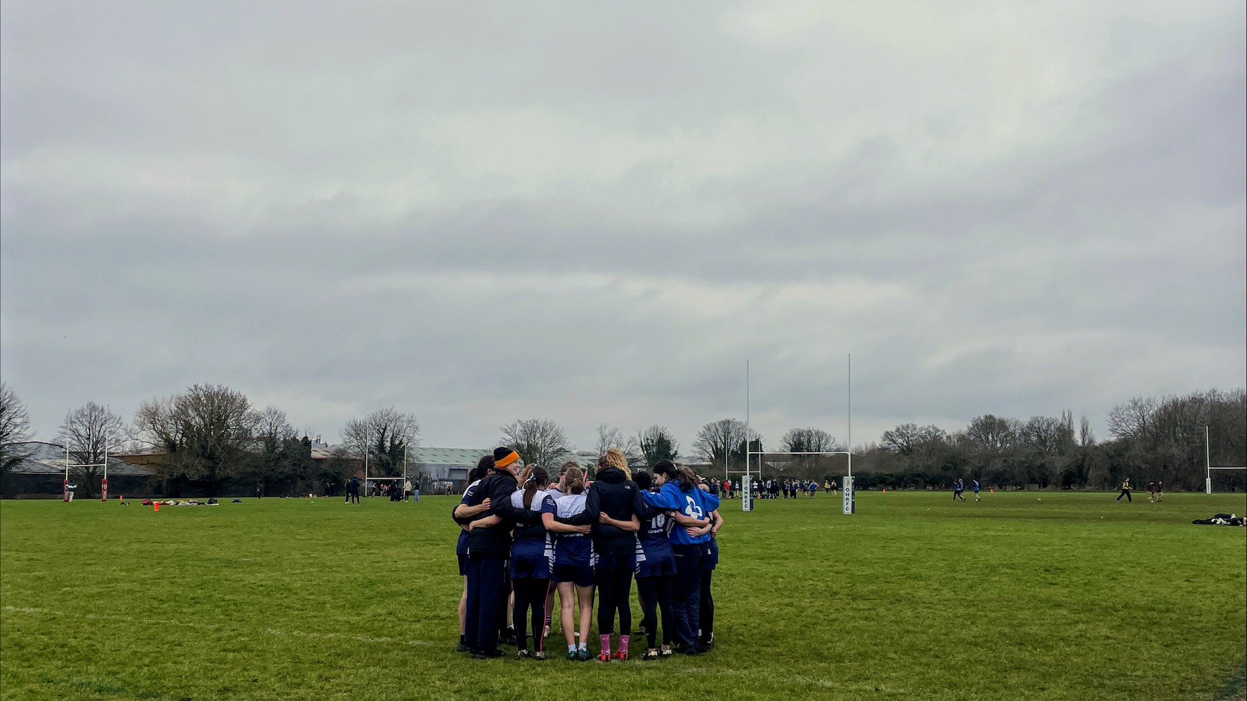 Huddle during a touch rugby match.